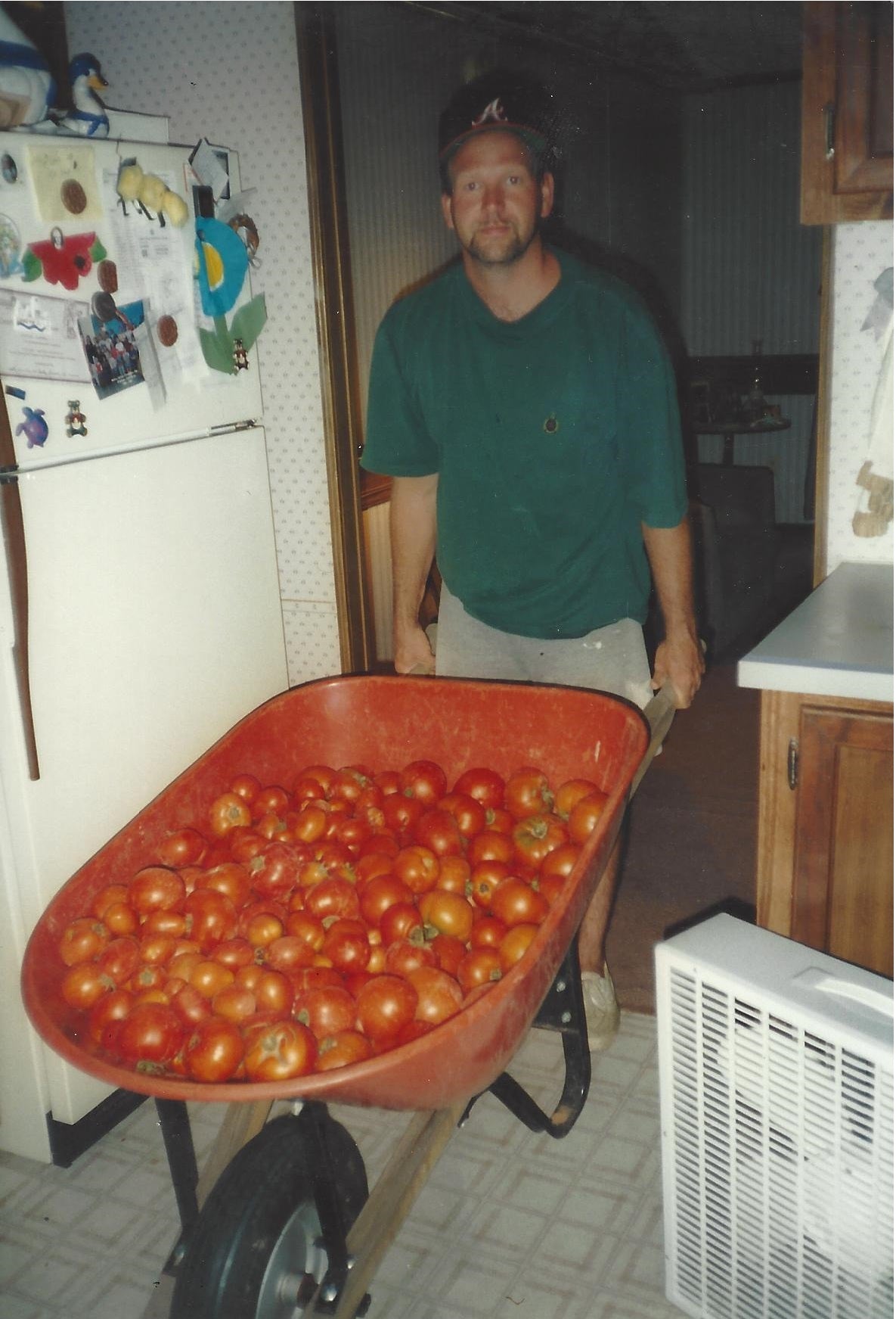 The Story of Gro-Rite Garden - Dad with lots of tomatoes